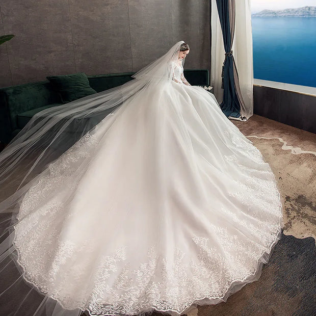 Neues Vintage-Hochzeitskleid mit O-Ausschnitt und vollen Ärmeln