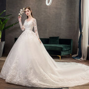 Neues Vintage-Hochzeitskleid mit O-Ausschnitt und vollen Ärmeln